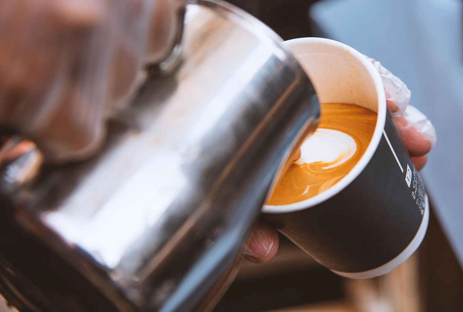 Barista pouring latte art